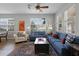 Spacious living room featuring hardwood floors, lots of natural light, stylish furnishings, and a welcoming atmosphere at 9228 Cardinal Meadow Trl, Orlando, FL 32827