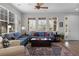 Bright and airy living room offering hardwood floors, ample natural light, stylish decor, and a welcoming atmosphere at 9228 Cardinal Meadow Trl, Orlando, FL 32827
