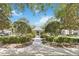 A charming gazebo amidst lush greenery and trees provides a serene community gathering space at 9686 Cypress Pine St, Orlando, FL 32827