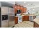 Bright kitchen with stainless steel appliances, custom cabinets, and granite countertops at 9686 Cypress Pine St, Orlando, FL 32827