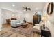 Bright living room with stylish decor, ceiling fan, and wood-look floors at 9686 Cypress Pine St, Orlando, FL 32827