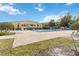 Large community pool with lounge chairs offers a relaxing recreation area at 9686 Cypress Pine St, Orlando, FL 32827