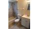 A bathroom with a tiled shower, toilet, and a vanity at 9916 Sweepstakes Ln # 1, Orlando, FL 32837