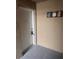 A secure entrance to a condo with gray floors and a neutral decor at 9916 Sweepstakes Ln # 1, Orlando, FL 32837