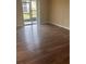 Bright living room features modern floors and sliding glass doors to a patio at 9916 Sweepstakes Ln # 1, Orlando, FL 32837