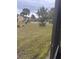 Community pool surrounded by palm trees at 9916 Sweepstakes Ln # 1, Orlando, FL 32837