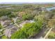 Aerial view of a charming home surrounded by lush greenery in a peaceful neighborhood at 12018 Radbourne St, Winter Garden, FL 34787