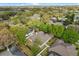Aerial view of landscaped home surrounded by lush green trees in a peaceful neighborhood at 12018 Radbourne St, Winter Garden, FL 34787