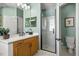 Bathroom featuring a glass enclosed shower, dual sink vanity, and a toilet at 12018 Radbourne St, Winter Garden, FL 34787
