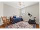 Cozy bedroom with a daybed, ceiling fan, and an exercise bike for a convenient workout at 12018 Radbourne St, Winter Garden, FL 34787
