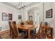 Elegant dining room featuring hardwood floors and a decorative light fixture at 12018 Radbourne St, Winter Garden, FL 34787