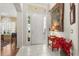 Inviting entryway with a decorative rug, tiled floors, and a bright front door at 12018 Radbourne St, Winter Garden, FL 34787