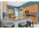 Modern kitchen with granite countertops, stainless steel appliances, and a breakfast bar at 12018 Radbourne St, Winter Garden, FL 34787