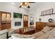 Spacious living room with a fireplace, hardwood floors, and modern decor at 12018 Radbourne St, Winter Garden, FL 34787