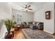 Inviting living room with a large sectional, hardwood floors, and stylish decor accents at 12018 Radbourne St, Winter Garden, FL 34787
