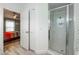 Bathroom featuring stand up shower with glass doors, open to bedroom at 127 Thorne Meadow Pass, Davenport, FL 33897