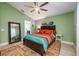 Bright bedroom featuring vaulted ceilings, wooden ceiling fan, and a full length mirror at 127 Thorne Meadow Pass, Davenport, FL 33897