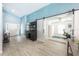 Spacious foyer leading to the office space, featuring a large sliding barn door at 127 Thorne Meadow Pass, Davenport, FL 33897