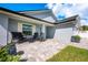 Charming front porch with stylish outdoor seating and beautiful landscaping at 127 Thorne Meadow Pass, Davenport, FL 33897