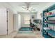 Bright home office with modern decor and an accent bookcase at 127 Thorne Meadow Pass, Davenport, FL 33897