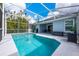A screened-in pool is surrounded by ample deck space, perfect for entertaining and relaxation at 127 Thorne Meadow Pass, Davenport, FL 33897