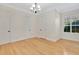 Spacious room with hardwood floors and a window, offering abundant natural light at 12848 Jacob Grace Ct, Windermere, FL 34786