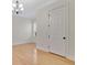 Empty room with hardwood floors, crown molding, and a window with shutters at 12848 Jacob Grace Ct, Windermere, FL 34786