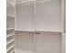 Walk-in closet with white shelving units and chrome rods, maximizing storage at 12848 Jacob Grace Ct, Windermere, FL 34786