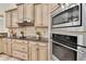 Close up of the kitchen featuring stainless steel appliances and custom cabinetry at 12848 Jacob Grace Ct, Windermere, FL 34786
