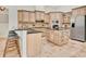 Spacious kitchen with stainless steel appliances, a center island, and custom cabinetry at 12848 Jacob Grace Ct, Windermere, FL 34786