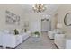 An airy living room boasts neutral tones, high ceilings, and modern decor at 12848 Jacob Grace Ct, Windermere, FL 34786