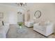 Airy living room featuring neutral tones, high ceilings, and modern decor at 12848 Jacob Grace Ct, Windermere, FL 34786