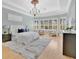 Serene main bedroom with tray ceiling, plantation shutters, and ample natural light at 12848 Jacob Grace Ct, Windermere, FL 34786