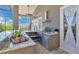 Covered outdoor kitchen with stainless steel grill and countertops perfect for outdoor dining at 12848 Jacob Grace Ct, Windermere, FL 34786
