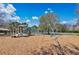 Community playground with swings, slides, and a play structure for outdoor fun at 12848 Jacob Grace Ct, Windermere, FL 34786