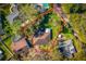 An aerial view displays the large lot size, mature trees, and nearby homes at 1321 Medinah Ct, Winter Park, FL 32792