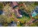 The home features an expansive lot surrounded by lush greenery, captured in this aerial shot at 1321 Medinah Ct, Winter Park, FL 32792