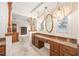 Bathroom featuring long vanity and decorative wallpaper at 1321 Medinah Ct, Winter Park, FL 32792
