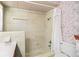 Bathroom featuring a shower with curtain, floral wallpaper, and tiled walls at 1321 Medinah Ct, Winter Park, FL 32792