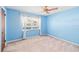 Bright bedroom with ceiling fan, a large window, and neutral carpet at 1321 Medinah Ct, Winter Park, FL 32792