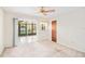 Bright bedroom featuring a ceiling fan and sliding glass doors leading to a screened patio at 1321 Medinah Ct, Winter Park, FL 32792