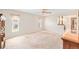Spacious bedroom with a ceiling fan and two windows at 1321 Medinah Ct, Winter Park, FL 32792