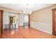 Bright dining area with hardwood floors and decorative columns overlooking the entryway at 1321 Medinah Ct, Winter Park, FL 32792