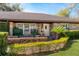 Charming front entrance featuring lush landscaping and a well-maintained lawn at 1321 Medinah Ct, Winter Park, FL 32792