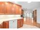 The kitchen overlooks the dining area with white countertops and a brick fireplace at 1321 Medinah Ct, Winter Park, FL 32792