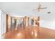 Bright living room with hardwood floors and open floor plan to the kitchen at 1321 Medinah Ct, Winter Park, FL 32792