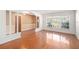 Spacious living room with wood floors, bright windows, and decorative columns at 1321 Medinah Ct, Winter Park, FL 32792