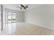 The bedroom has tile flooring, a ceiling fan, and sliding glass doors leading to the outdoor pool at 13254 Boulder Woods Cir, Orlando, FL 32824