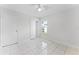Bright bedroom featuring tile floors, a ceiling fan, and a window at 13254 Boulder Woods Cir, Orlando, FL 32824