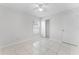 Bright bedroom featuring tile flooring, closet, window, and a ceiling fan at 13254 Boulder Woods Cir, Orlando, FL 32824
